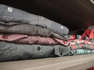 fold items to save space with your closet organization