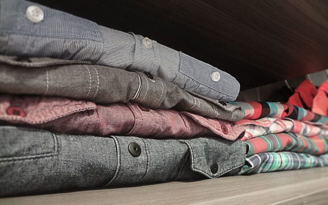 fold items to save space with your closet organization